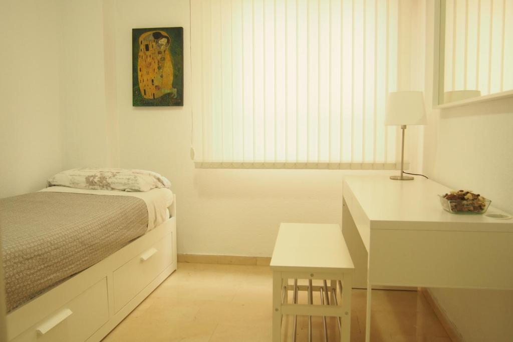 A bed or beds in a room at VERO Granada y PARKING en el edificio