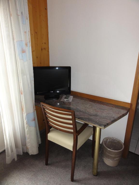 TV a/nebo společenská místnost v ubytování Hotel Steinbock Grindelwald