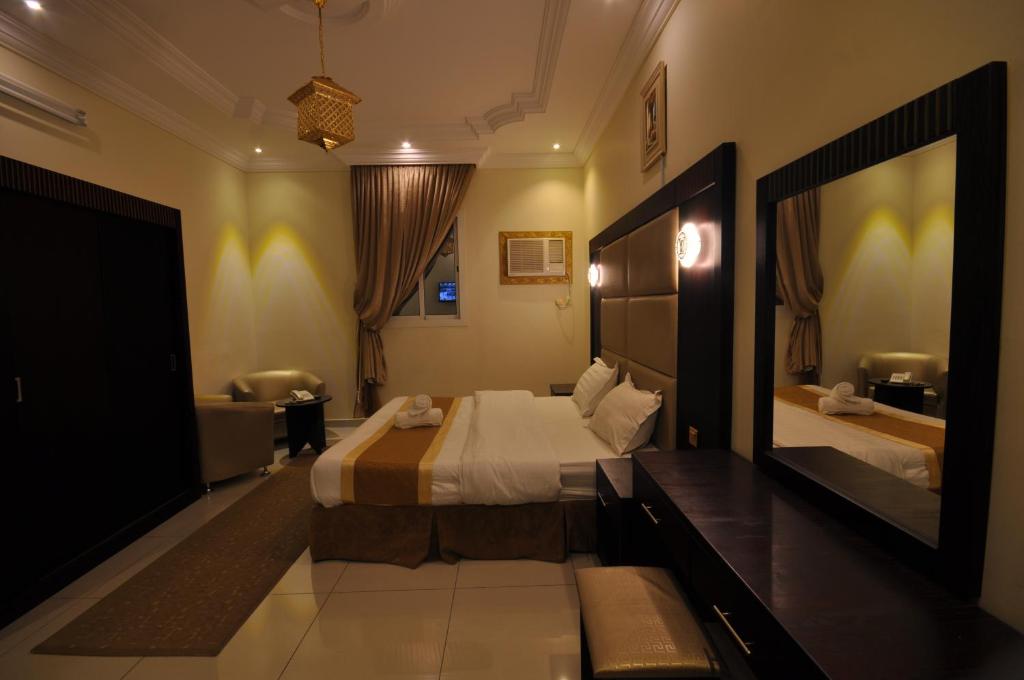 Postel nebo postele na pokoji v ubytování Ritan Apart-Hotel