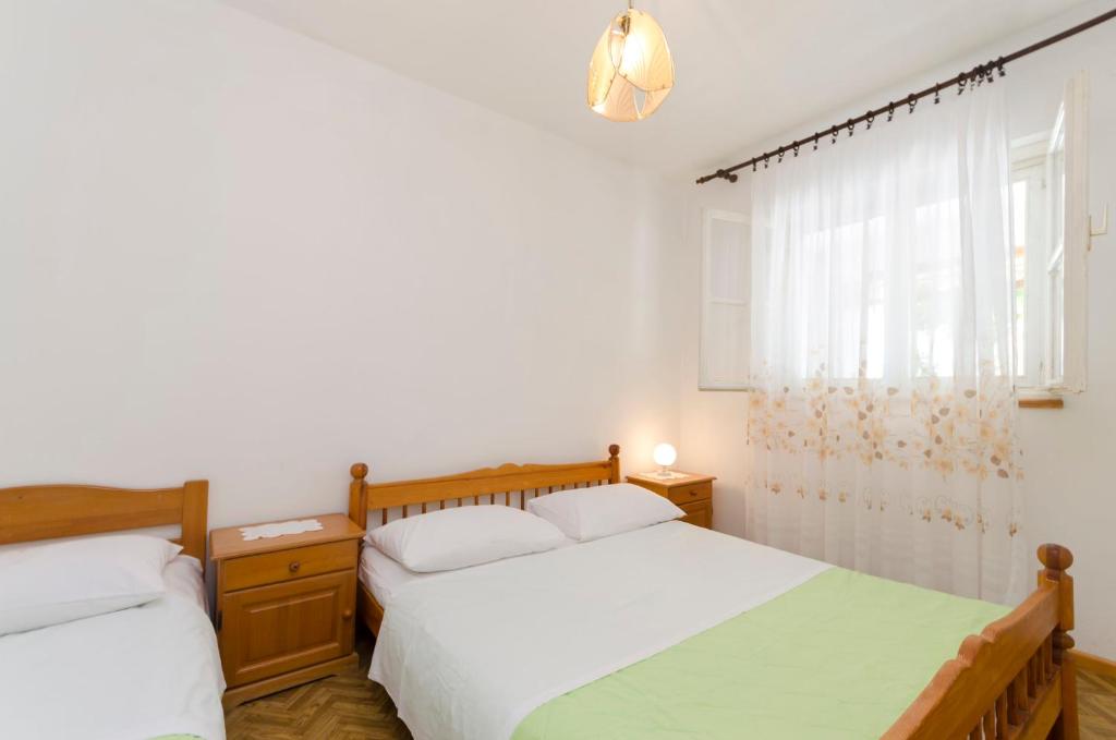Postel nebo postele na pokoji v ubytování Apartment Niko