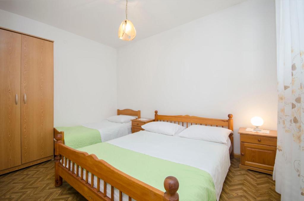 Postel nebo postele na pokoji v ubytování Apartment Niko