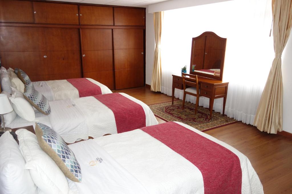 Postel nebo postele na pokoji v ubytování Hotel Maceo Chico