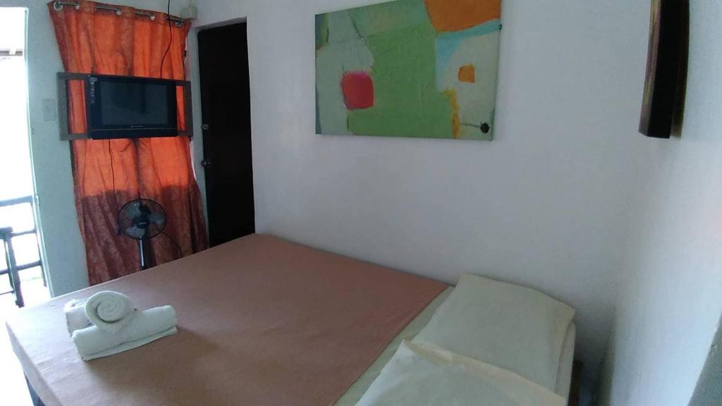 Postel nebo postele na pokoji v ubytování Dahilig Resort