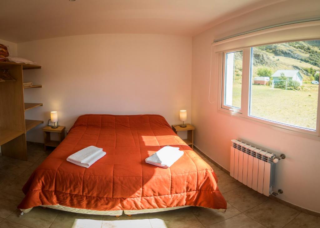 Giường trong phòng chung tại Las Agachonas Apart