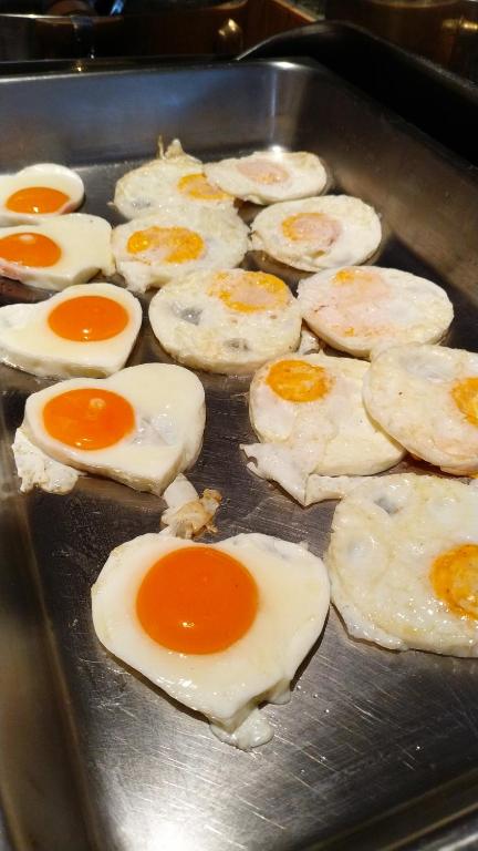 a bunch of eggs are cooking in a pan at Supalai Scenic Bay Resort And Spa, SHA Extra Plus in Por Bay