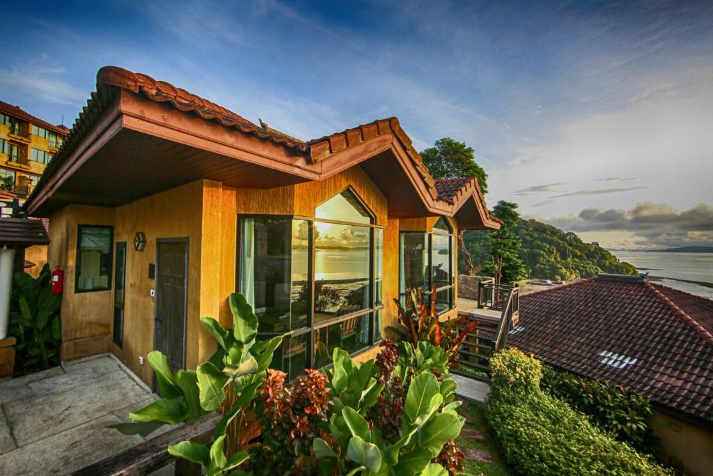 a house with a view of the ocean at Supalai Scenic Bay Resort And Spa, SHA Extra Plus in Por Bay