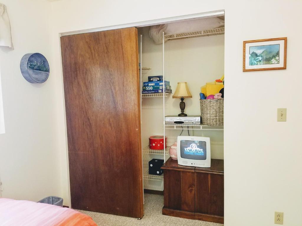 Postel nebo postele na pokoji v ubytování 'Ama'u Lani Cottage