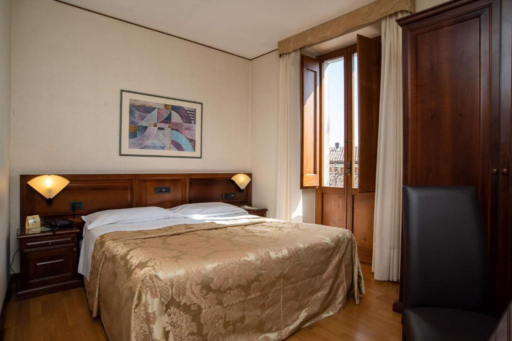 Postel nebo postele na pokoji v ubytování Hotel Fonte Cesia