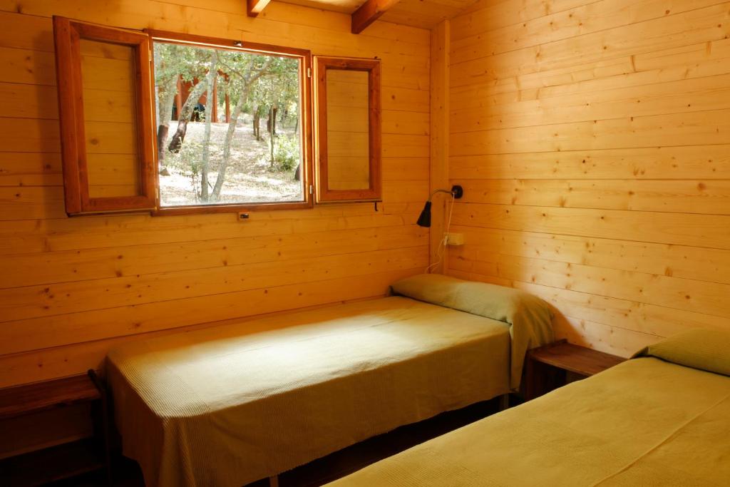 Postel nebo postele na pokoji v ubytování Camping Maçanet de Cabrenys