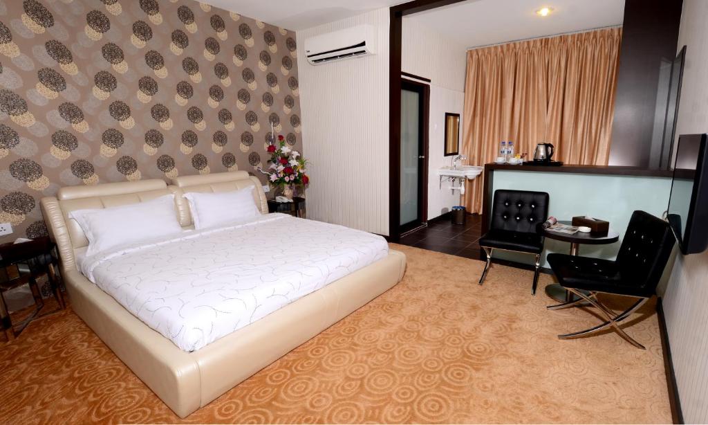 Postel nebo postele na pokoji v ubytování Hotel Tebrau CT