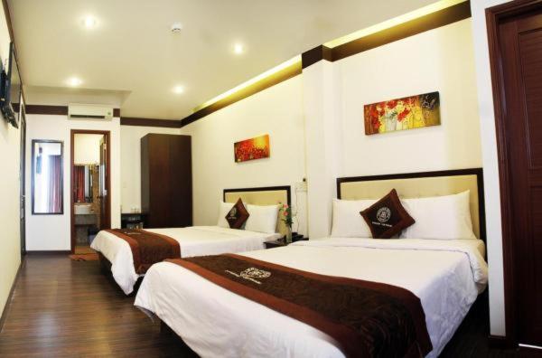 Postel nebo postele na pokoji v ubytování Brown Bean 2 Hotel