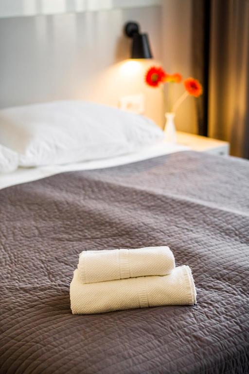 Postel nebo postele na pokoji v ubytování Garden Hotel