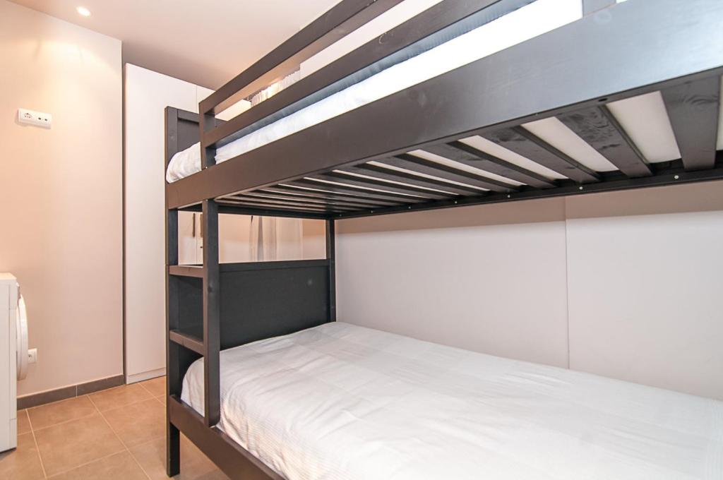 A bed or beds in a room at Weflating Diagonal