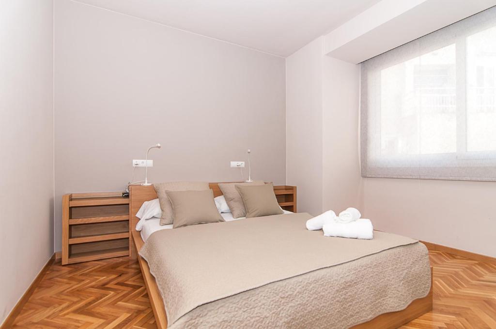 A bed or beds in a room at Weflating Diagonal