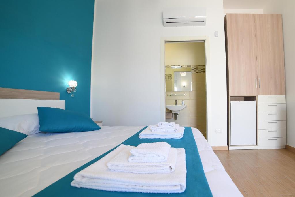 Postel nebo postele na pokoji v ubytování B&B Il FIORONE