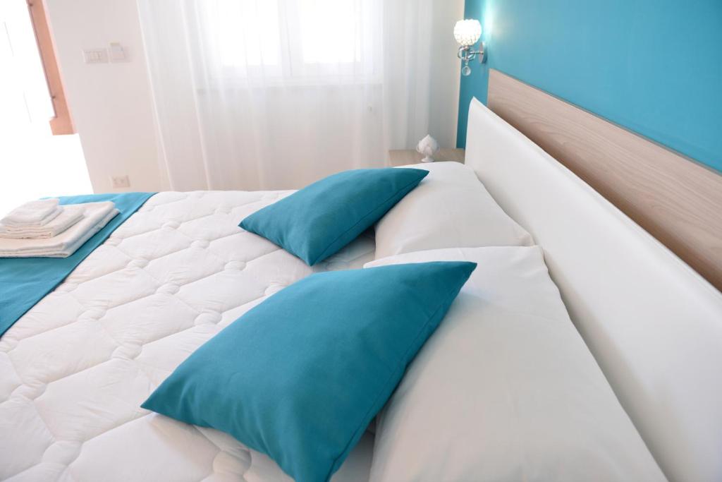 Postel nebo postele na pokoji v ubytování B&B Il FIORONE