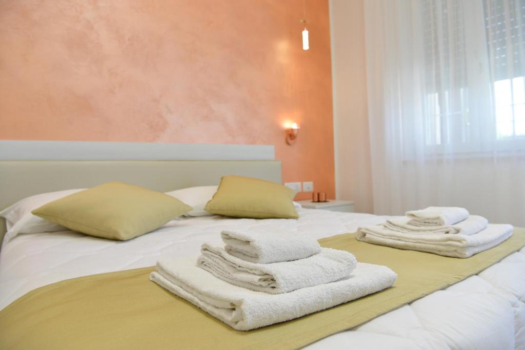 Postel nebo postele na pokoji v ubytování B&B Il FIORONE