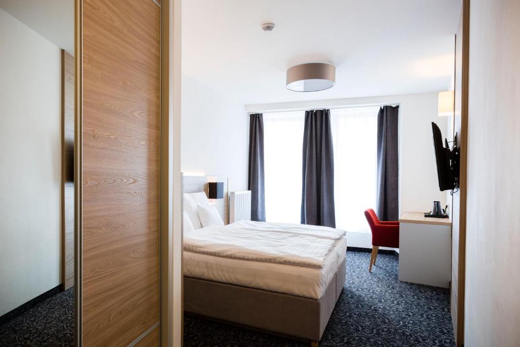 Postel nebo postele na pokoji v ubytování Hotel Koflík