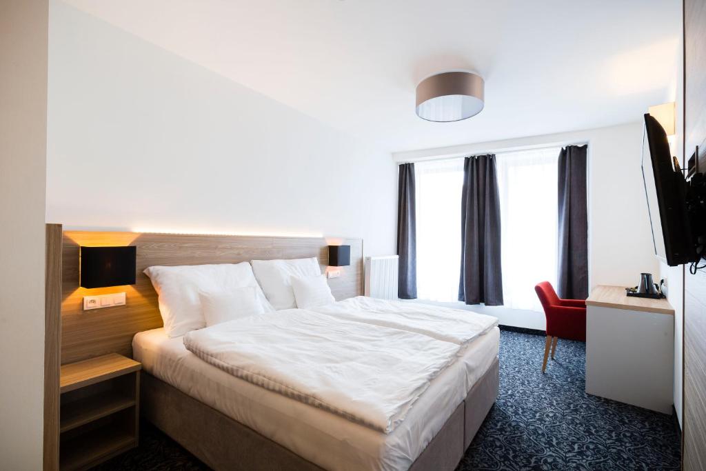 Postel nebo postele na pokoji v ubytování Hotel Koflík