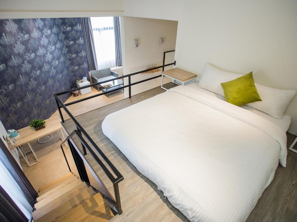 Postel nebo postele na pokoji v ubytování Rainbow Hotel
