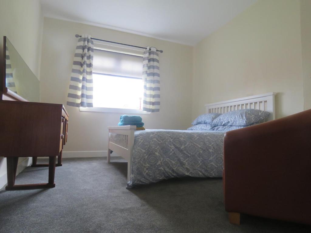 Una cama o camas en una habitación de Cunninghame House