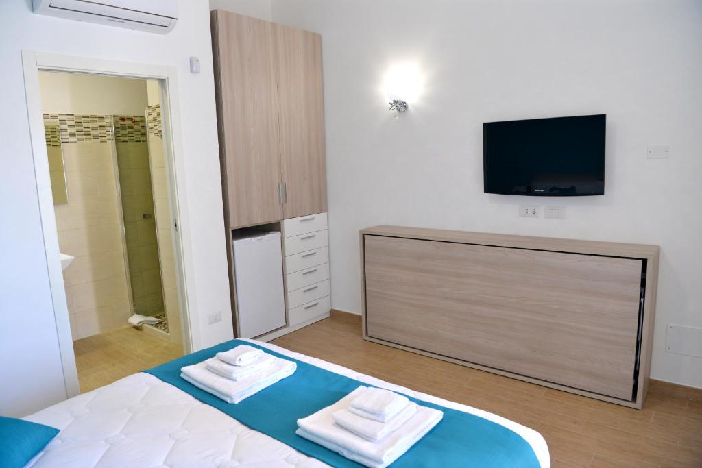 Postel nebo postele na pokoji v ubytování B&B Il FIORONE