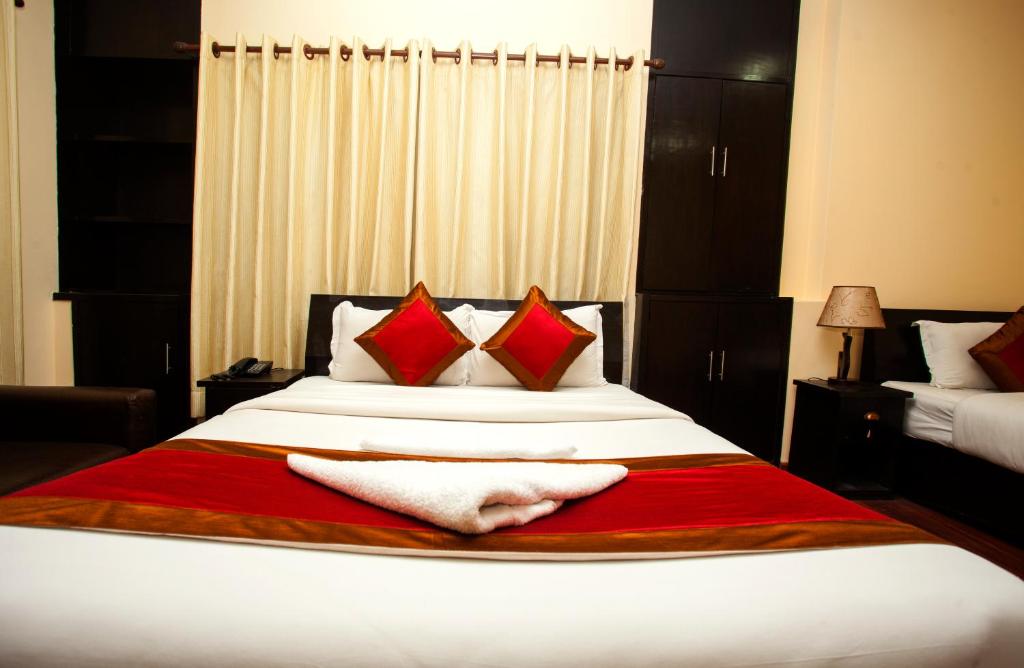 Postel nebo postele na pokoji v ubytování Hotel Dream City