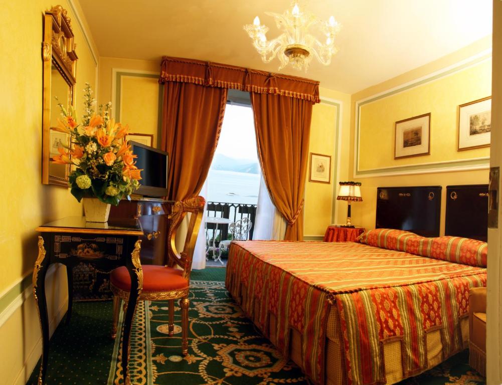 Postel nebo postele na pokoji v ubytování Grand Hotel des Iles Borromées & SPA