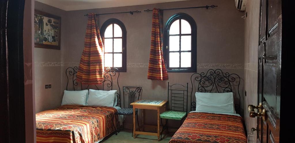 Postel nebo postele na pokoji v ubytování Hotel Wissam