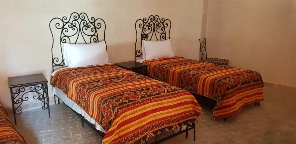 Postel nebo postele na pokoji v ubytování Hotel Wissam