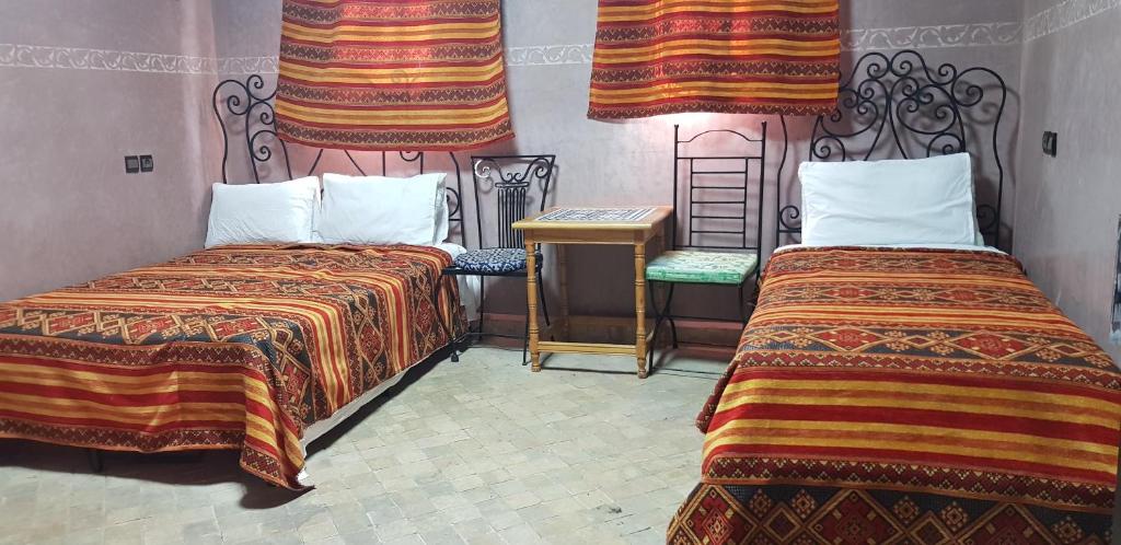 Postel nebo postele na pokoji v ubytování Hotel Wissam