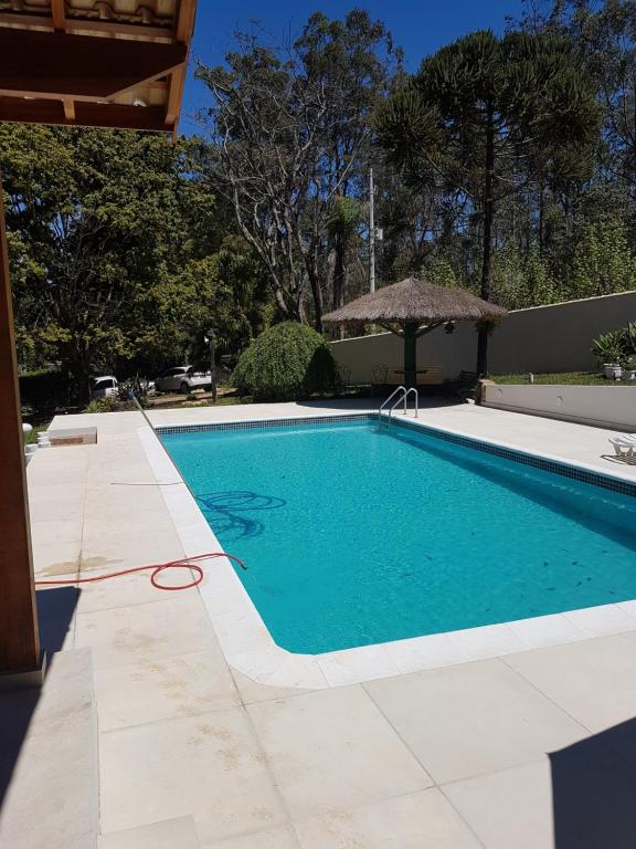 Bazén v ubytování Paz e Aconchego. nebo v jeho okolí