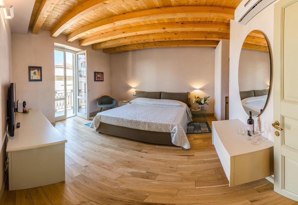Säng eller sängar i ett rum på Cantine De Gregorio Suites