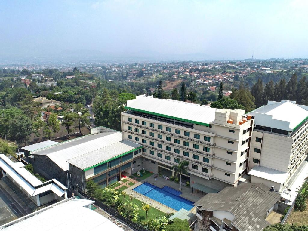 an overhead view of a building with a swimming pool at Novena Hotel Bandung in Bandung