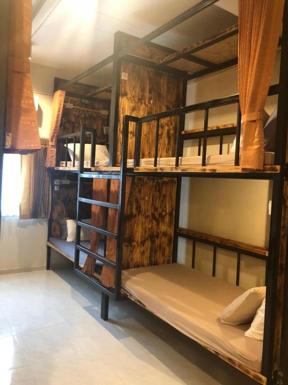 a group of bunk beds in a room at B&B hostel @ Jomtien in Jomtien Beach