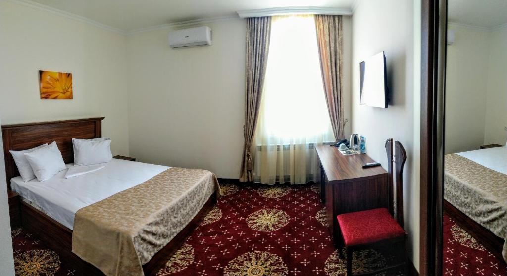 Postel nebo postele na pokoji v ubytování Georgia Hotel