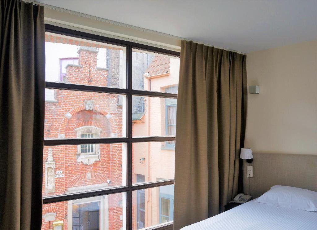 Postel nebo postele na pokoji v ubytování Hotel 't Putje