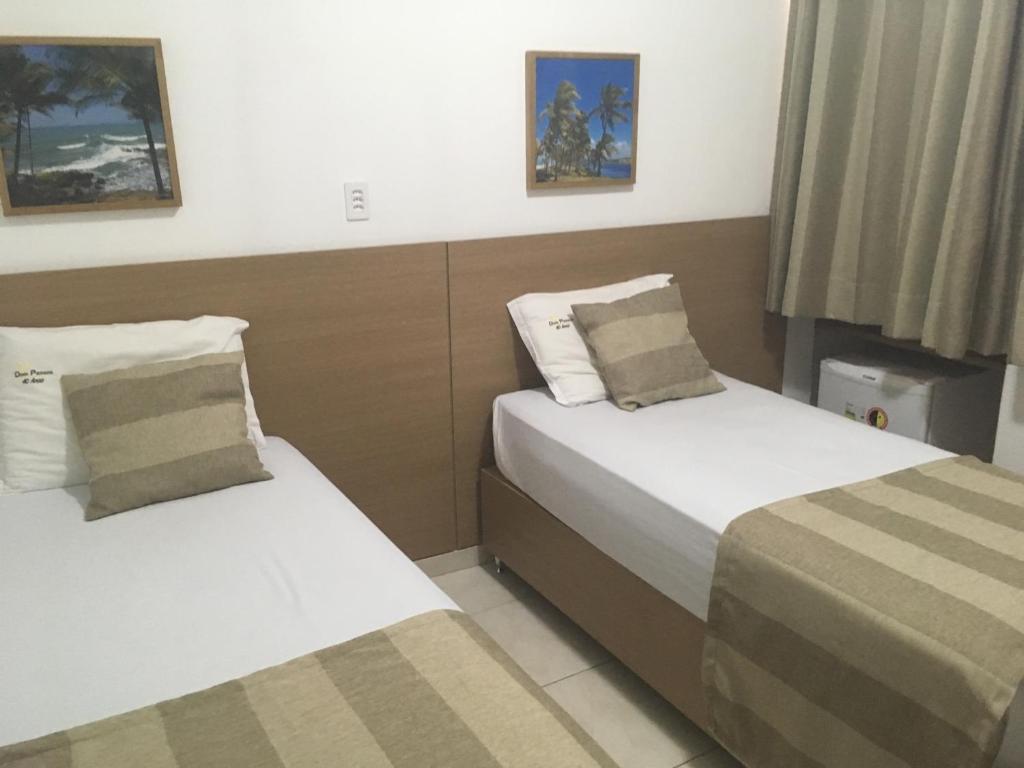 Postel nebo postele na pokoji v ubytování Hotel Dom Passos