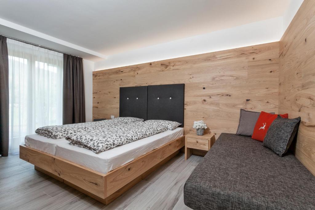 Postel nebo postele na pokoji v ubytování Junior Suite Orso Grigio