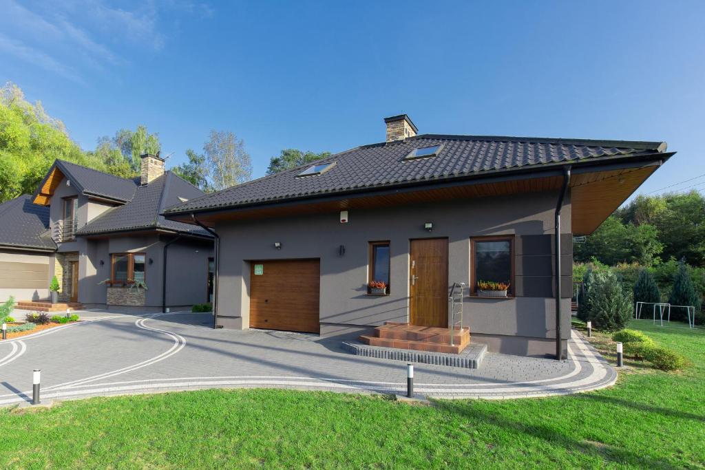 a rendering of a house with a driveway at Domek nad Zalewem in Janów Podlaski