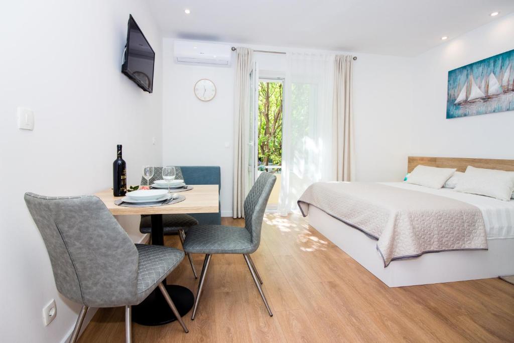 Posteľ alebo postele v izbe v ubytovaní Lugo Apartments