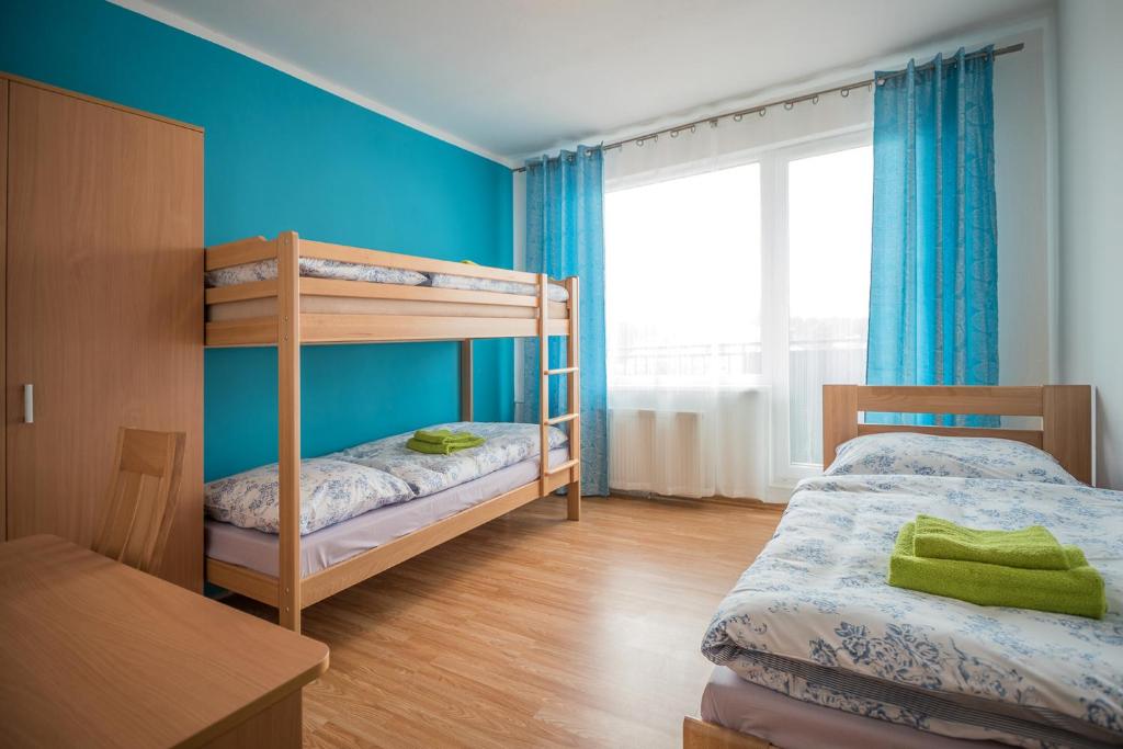 Postel nebo postele na pokoji v ubytování Hýbadlo