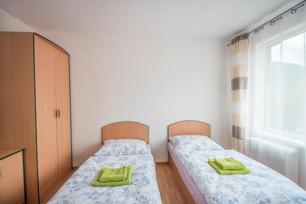 Postel nebo postele na pokoji v ubytování Hýbadlo