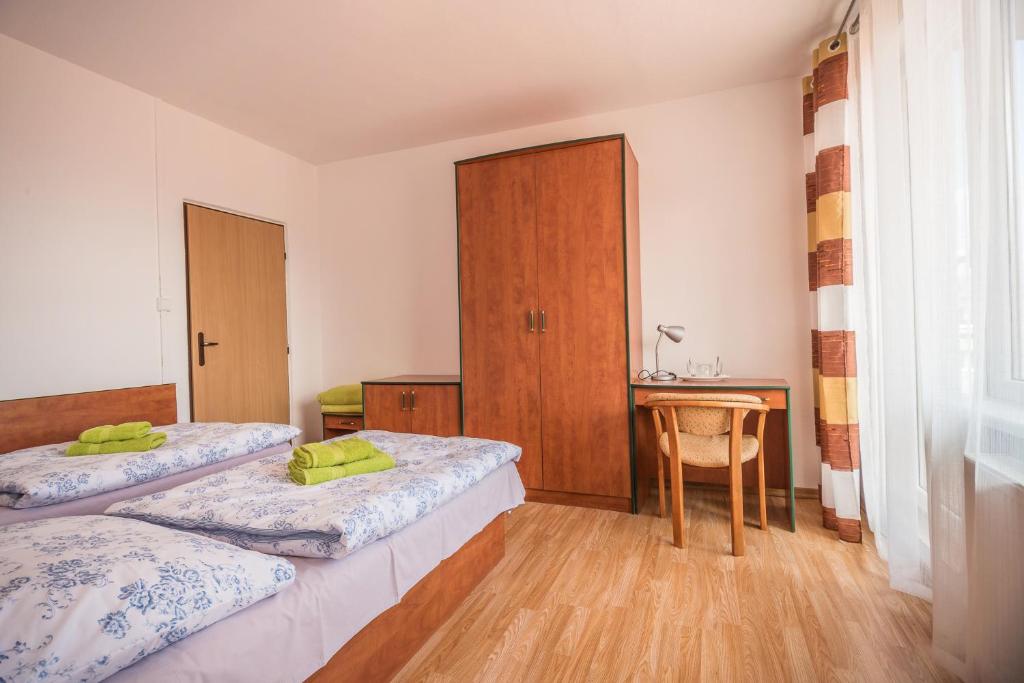 Postel nebo postele na pokoji v ubytování Hýbadlo