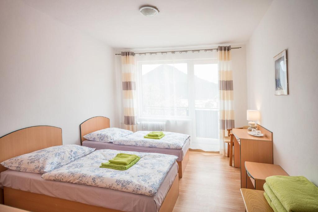 Postel nebo postele na pokoji v ubytování Hýbadlo