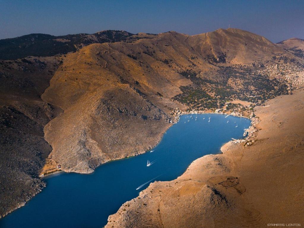 an aerial view of a lake in the middle of a mountain at Irene Double Apartment Katoi in Symi
