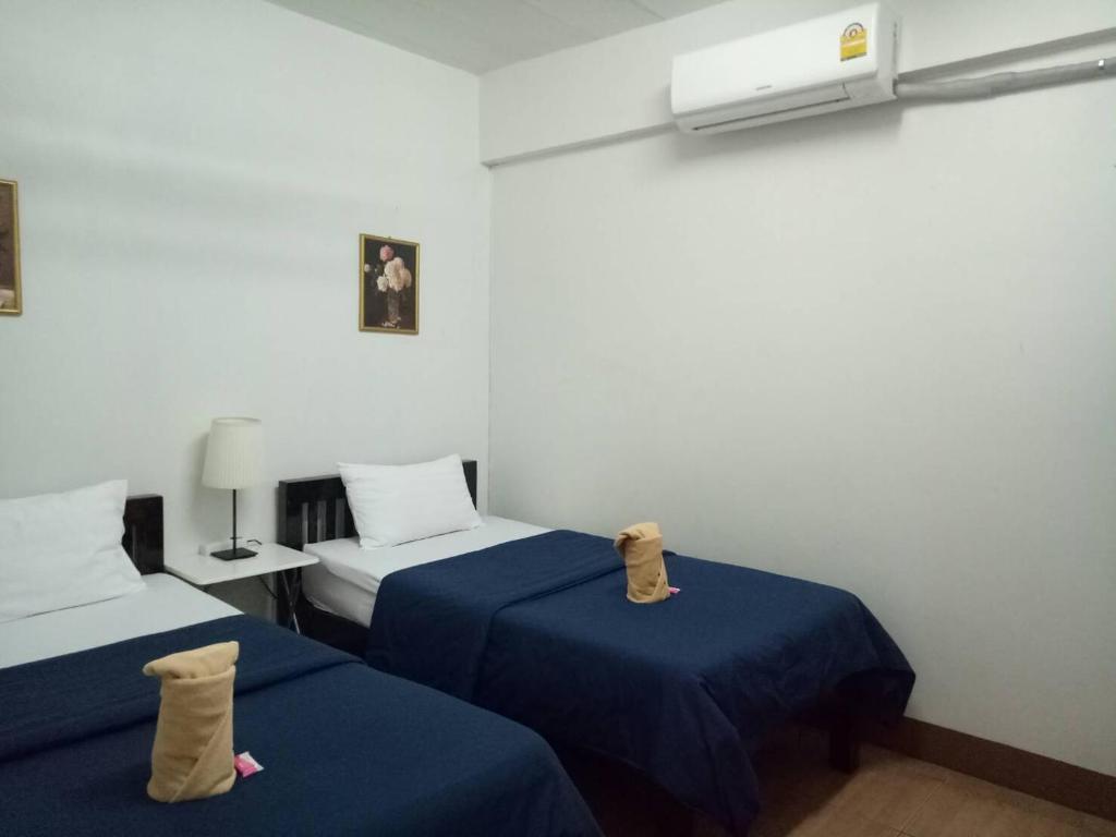 Кровать или кровати в номере TT Hostel Chiangrai