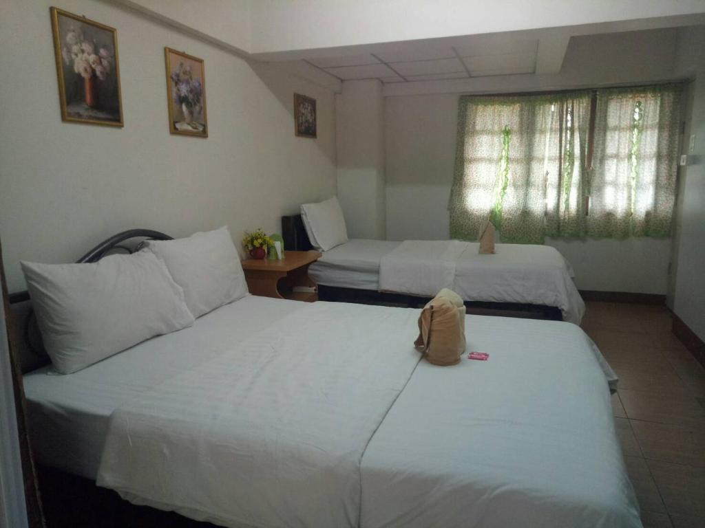 Voodi või voodid majutusasutuse TT Hostel Chiangrai toas