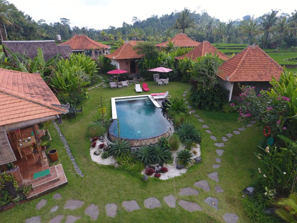 an aerial view of a backyard with a swimming pool at Bali Sawah Indah in Ubud