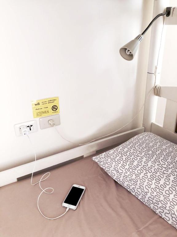 Letto o letti in una camera di Ahiruyah Guesthouse